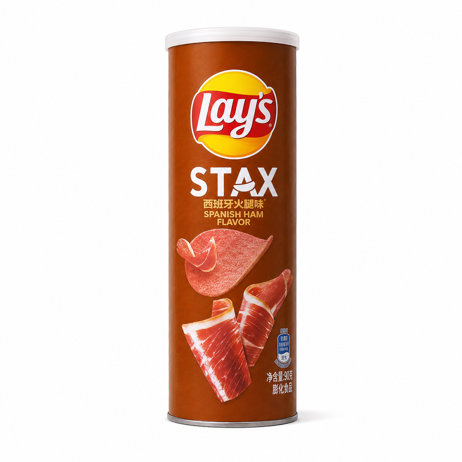 A single can of Lay's STAX Spanish Ham flavor potato chips on a clean white background. The cylindrical packaging is brown with a white top rim, featuring the red and yellow Lay's logo, the word STAX in large white letters, and illustrations of sliced Spanish ham.